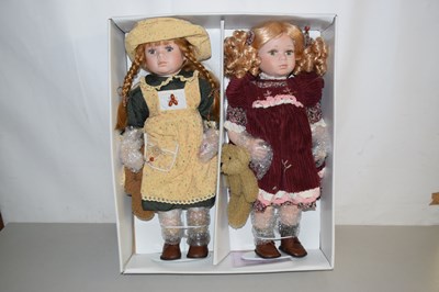 Lot 571 - A pair of boxed porcelain collectors dolls