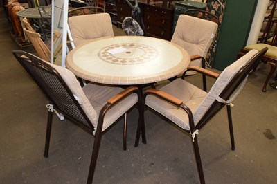 Lot 713 - A simulation stone patio table together with...