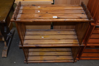 Lot 736 - A three shelf shoe rack