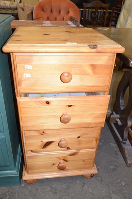 Lot 748 - A tall pine four drawer bedside cabinet