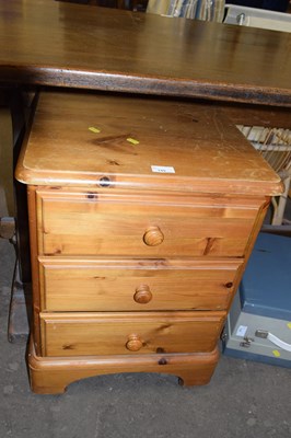 Lot 749 - A three drawer pine bedside cabinet