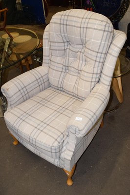 Lot 771 - A modern upholstered button back armchair
