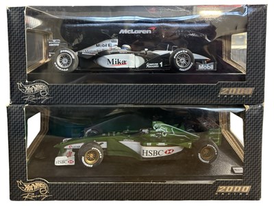 Lot 178 - A pair of boxed Hotwheels 1:18 scale racecars,...