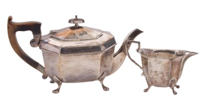 Lot 1 - A George VI silver teapot and milk jug of...