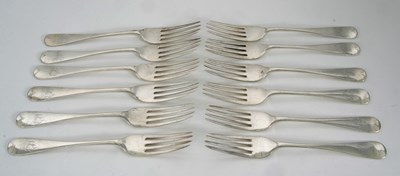 Lot 12 - A set of twelve George V silver table forks,...