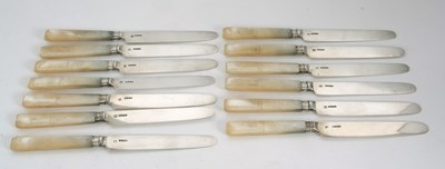 Lot 24 - Thirteen George IV silver bladed and carved...