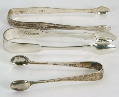 Lot 39 - A group of three pairs of silver sugar tongs...