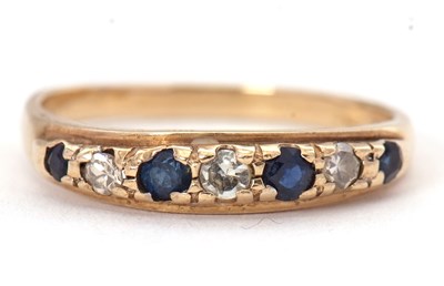 Lot 57 - A 9ct sapphire and diamond ring, the...