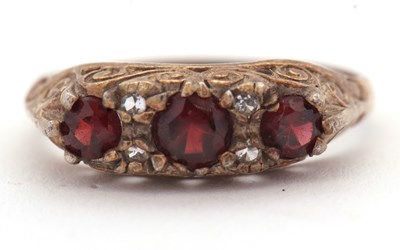 Lot 88 - A garnet and white stone ring, the three...