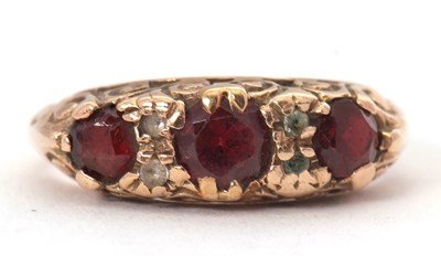 Lot 42 - A 9ct garnet and white stone ring, the three...
