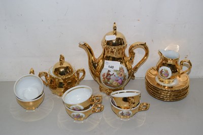 Lot 140 - A gold lustre finish coffee set