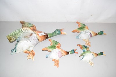 Lot 227 - A group of four retro wall ducks, some with...