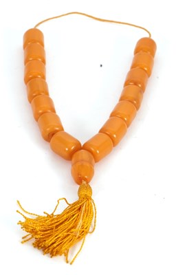 Lot 186 - An amber bead necklace, the barrel shape amber...