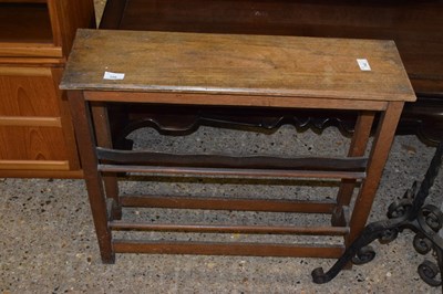 Lot 328 - An oak shoe rack