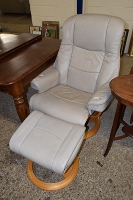 Lot 345 - A Stressless style leather swival armchair and...