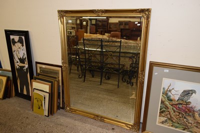 Lot 370 - A large modern rectangular wall mirror in a...
