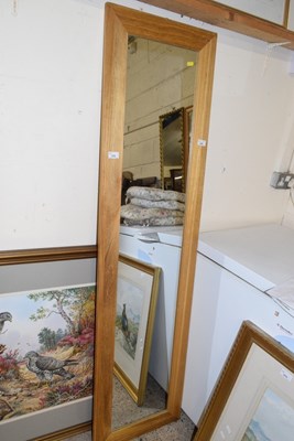 Lot 372 - A narrow oak framed wall mirror