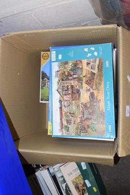 Lot 579 - A large box of various jigsaw puzzles -...