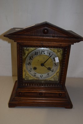 Lot 697 - A large wooden mantel clock