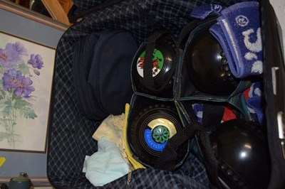 Lot 746 - Small suitcase containing lawn bowls