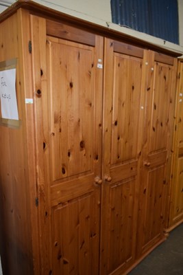 Lot 751 - A three door pine wardrobe