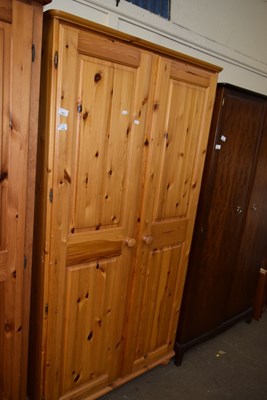 Lot 752 - A two door pine wardrobe