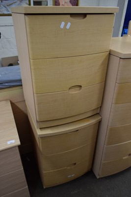 Lot 829 - Pair of Alstons light wood three drawer modern...