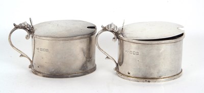Lot 63 - A pair of George V silver mustard pots and...