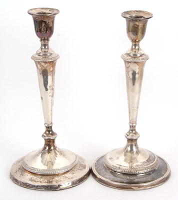 Lot 92 - A pair of George III silver candlesticks in...