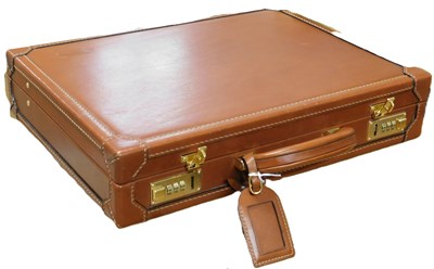 Lot 142 - A briefcase by Lancel, Paris, the tan leather...