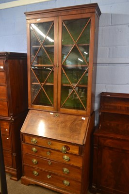 Lot 454 - A late Georgian mahogany bureau bookcase...