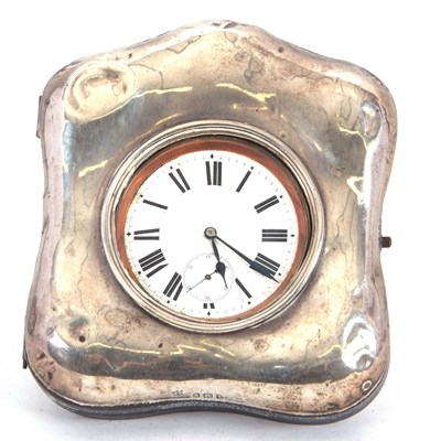 Lot 197 - A silver fronted travel clock case with metal...