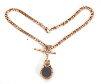 Lot 210 - A yellow metal double Albert chain suspending...