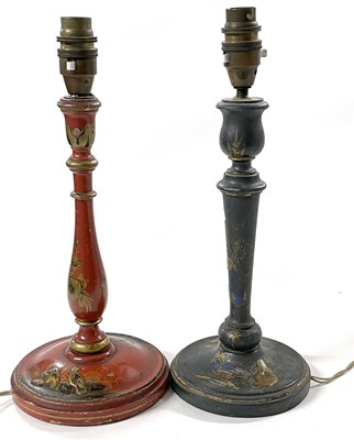 Lot 221 - Two wooden candlesticks with painted and...