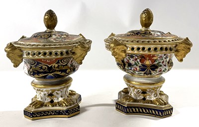 Lot 289 - A pair of Derby pastille burners and covers,...