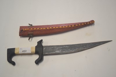 Lot 492 - A North African small dagger with applied bone...