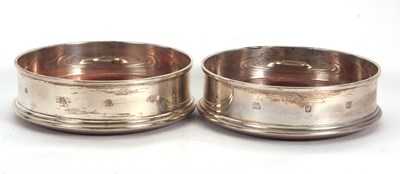 Lot 58 - A pair of Elizabeth II silver bottle coasters,...