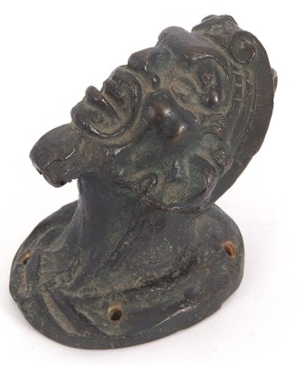 Lot 119 - An antique bronze door knob modelled as a...