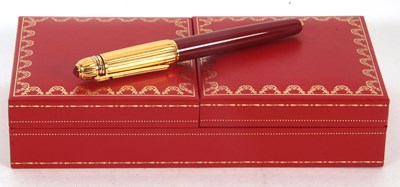 Lot 137 - A Pasha De Cartier fountain pen (1990) dark...