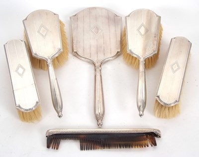 Lot 165 - A George V six piece silver backed dressing...