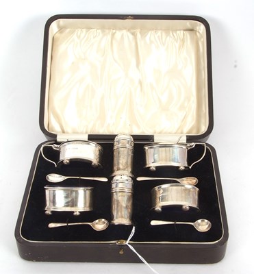 Lot 176 - A George V silver six piece condiment set...