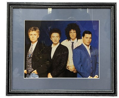 Lot 125 - QUEEN: A framed and glazed signed photograph,...
