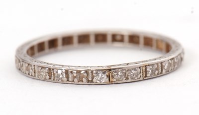 Lot 16 - A diamond eternity ring, the full hoop ring...