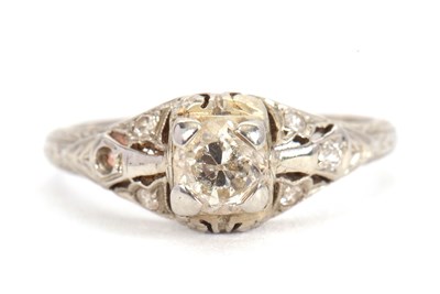 Lot 5 - A single stone diamond ring, the round...