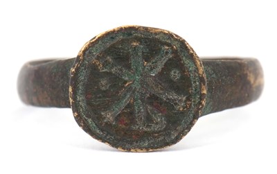 Lot 188 - A Byzantine chi rho ring, possibly in bronze,...