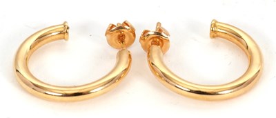 Lot 137 - A pair of 18ct earhoops, the 3/4 hoops with...