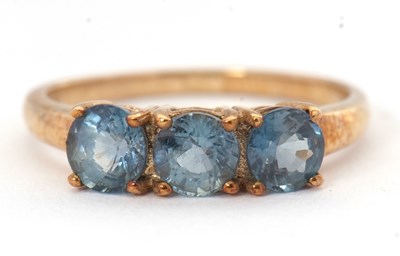 Lot 54 - A 9ct three stone ring, the three round pale...