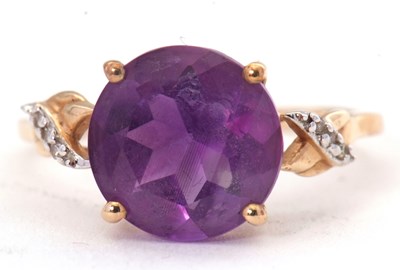 Lot 51 - A 9ct amethyst and diamond ring, the round...