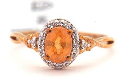Lot 46 - A 9ct 'mandarin' garnet and zircon ring, the...
