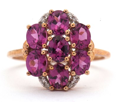 Lot 47 - A 9ct garnet and diamond cluster ring, set...
